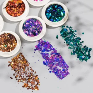 Glitter swatches applied next to opened sequin jars showing texture and color payoff
