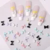Glossy Bow Nail Charms - Sweet Sparkle with Diamond Shine 11 Multicolor glossy bow nail charms with rhinestones in various shades on display
