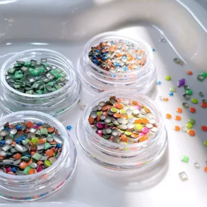 Bright macaron nail glitter under natural light in clear jars