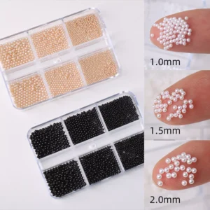 Assorted glossy pearl nail beads in 1mm to 2mm sizes – white, nude, black tones