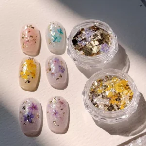 Pressed flower glitter nails with gold foil and pastel dried flowers
