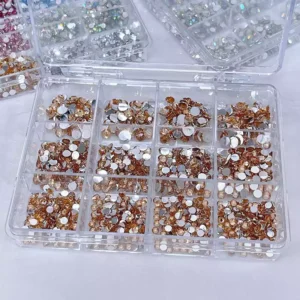 Golden flatback nail crystals packed in organized compartments