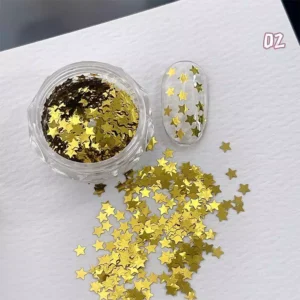 Gold metallic star nail sequins in round pot with scattered design