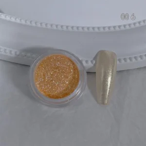 Golden yellow glitter nail powder with pearlized finish on nail tip