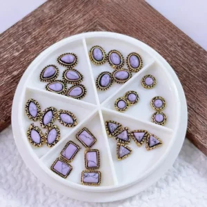 Gothic-inspired lavender gemstone nail decorations in assorted antique frames