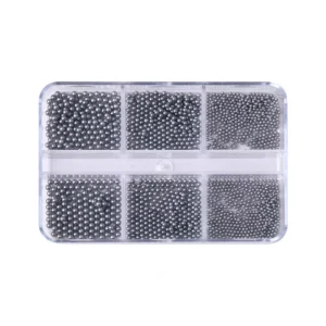 Metallic gray pearl nail beads organized in a transparent tray