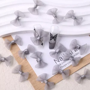 Gray mesh bow nail art decorations with butterfly nail design