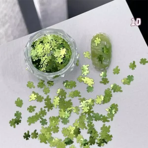 Iridescent green maple leaf-shaped nail glitter with natural-themed nail tip