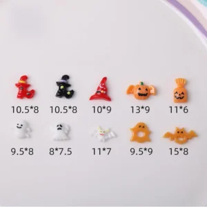 Halloween-themed resin nail charms with witch hats and ghosts