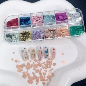Assorted heart and cross nail sequins in iridescent finish with sample nail tips