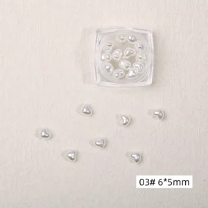Pearl white heart-shaped nail charms with a soft luster finish