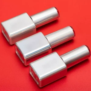 Colorful Gel Polish bottles on red backdrop for contrast