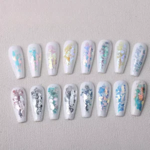 Nail swatches of 16 Aurora Opal Nail Glitter flakes on white polish