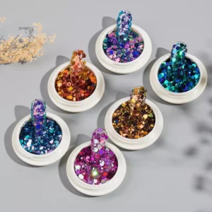 Close-up of Party Nail Sequins with plastic swatches dipped into glitter pots
