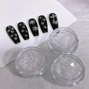 Holographic crystal nail flakes in jars with black nail tip display