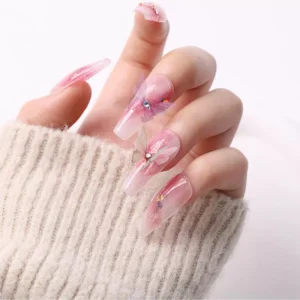 Close-up of iridescent butterfly nail charms layered with shimmer