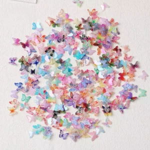 Full spread of dreamy iridescent butterfly nail charms with mixed sizes and colors