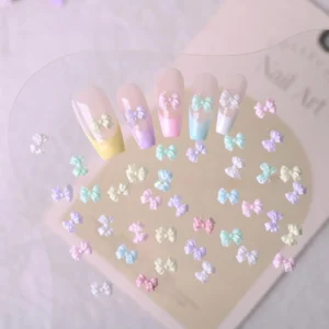 Transparent sheet displaying pastel candy bow nail charms – 3D kawaii resin bow accents