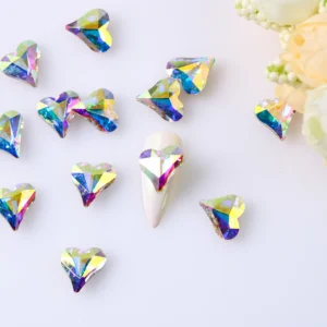 Faceted heart-shaped nail crystals in aurora iridescent finish