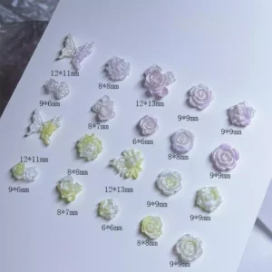 Iridescent resin flower charms in pastel yellow and lavender, laid out with size info