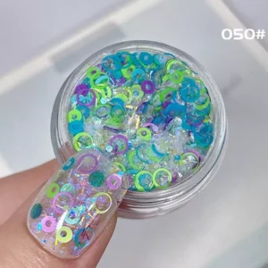 Translucent frosty glitter with blue, green, and violet sequin circles for nail art