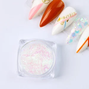 Fine iridescent shredded nail glitter in a clear container with pastel tones