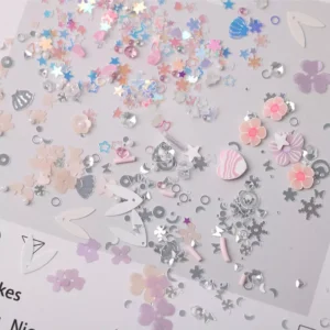 Mixed pastel and silver sequins including snowflakes, flowers, and 3D hearts