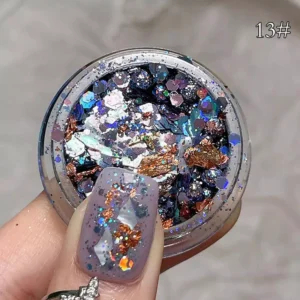 Iridescent purple and black flakes mixed with holographic accents for nails