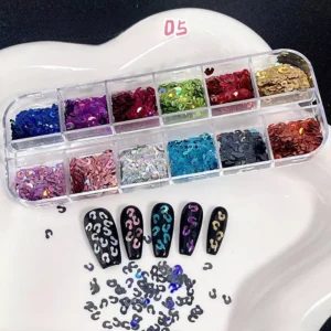 Holographic question mark glitter sequins on black nail art display