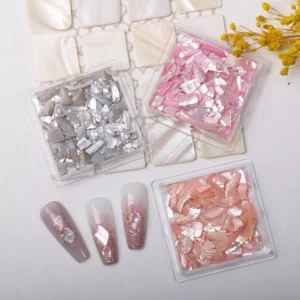 Pink, silver, and peach abalone nail flakes with example designs