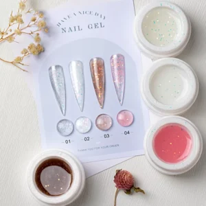 Close-up of iridescent sparkle builder gels in white jars with shade chart