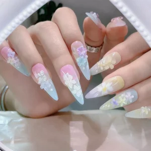 3D pastel floral nail art on long stiletto-shaped nails