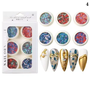 Jewel-tone crushed nail flakes in metallic finishes with gold-accented designs