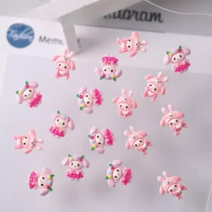 Pastel pink bunny and cartoon girl resin nail charms with festive outfits