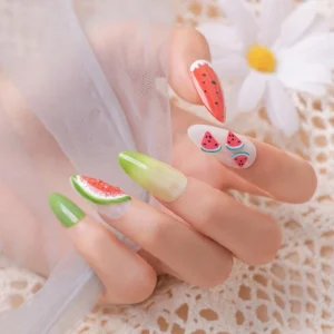Watermelon-inspired 3D kawaii nail art featuring fruit charms
