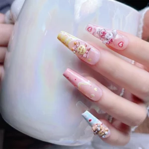 Close-up of nails with bear, bunny, and tiger 3D Mikko Nail Charms and pink art