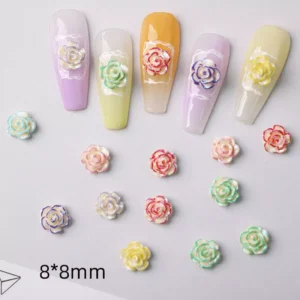 Assorted resin rose nail charms with shimmer coating, displayed with size indicator