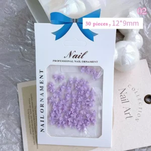 Lavender-colored resin bow nail charms in full pack
