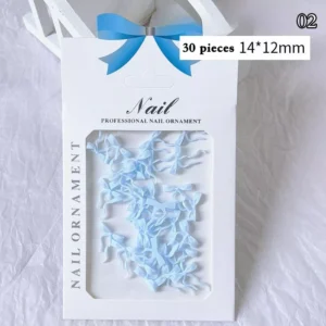 Light blue bow ribbon nail charms in a professional packaging with 30 pieces