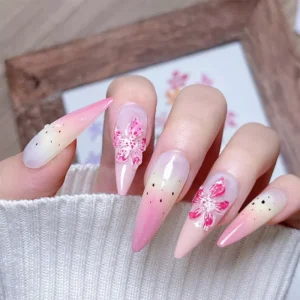 Five nail designs featuring 3D lily flower stickers on gradient tips