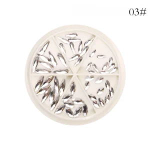 Elongated silver crystal nail rhinestones organized by size