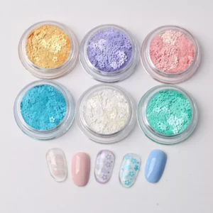 Floral nail sequins in pastel macaron colors displayed in transparent jars