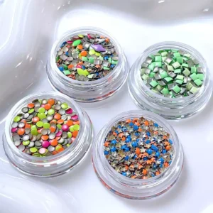 Macaron nail decorations with colorful round, square, and star glitter in clear jars