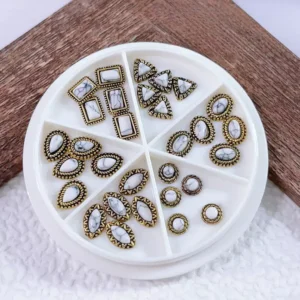 White marble effect gemstone nail embellishments with baroque metal trim