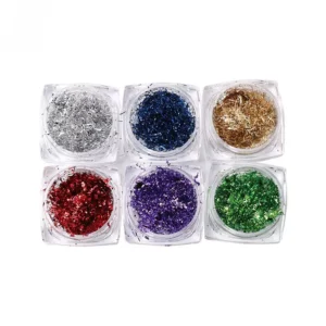 Compact foil flake nail set featuring six metallic glitter colors in a square arrangement