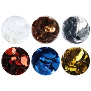 Close-up view of individual glitter colors including gold, blue, red, and silver