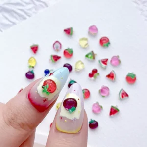 Fruit nail charms applied on pastel-themed nail extensions
