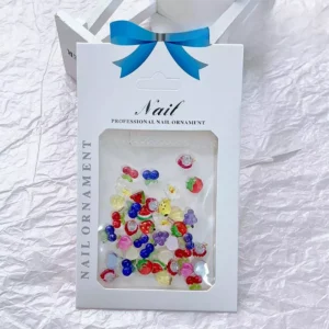 Packaged mini fruit nail charms with assorted 3D designs