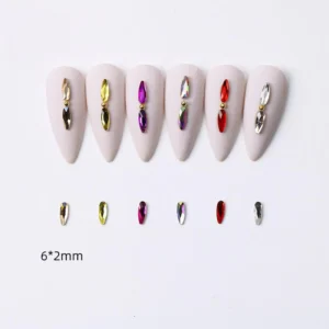 Mini narrow flatback nail crystals arranged in pairs on neutral-toned nails