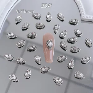 Compact teardrop rhinestone charm for nails in silver setting